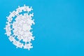 White jigsaw pieces on a blue background, Copy space, Concept image of unfinished task.  missing jigsaw puzzle pieces and business Royalty Free Stock Photo