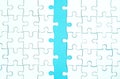 White jigsaw of puzzle on blue background. Royalty Free Stock Photo