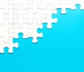 White jigsaw puzzle on blue background Royalty Free Stock Photo