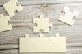 White jigsaw puzzle connecting together. Team business success partnership or teamwork concept. A group of business people Royalty Free Stock Photo