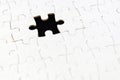 White jigsaw puzzle with missing piece on black. Business concept. Black and white jigsaw puzzle background. Business concept.