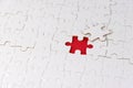 White jigsaw puzzle with missing piece on red. Business concept. Problem solved and solution.