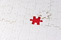 White jigsaw puzzle with missing piece on red. Business concept. Problem solved and solution.