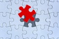 White jigsaw puzzle pieces on gray background Royalty Free Stock Photo