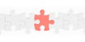 White jigsaw puzzle pieces row with red one isolated with clipping path Royalty Free Stock Photo