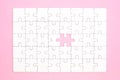 White jigsaw puzzle on pink background Royalty Free Stock Photo