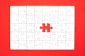 White jigsaw puzzle on red background Royalty Free Stock Photo