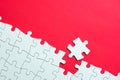 White jigsaw puzzle on red background Royalty Free Stock Photo