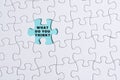 White jigsaw puzzle with words over blue background - What do you think.