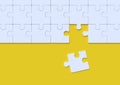 White jigsaw puzzle on yellow background Royalty Free Stock Photo