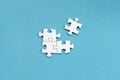 White jigsaw puzzles, on blue background