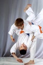 In white judogi two athletes are training throws Royalty Free Stock Photo
