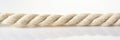 White jute rope banner size. Piece of ship rope, close-up on white background