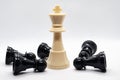 White king defeated black pawns. Strategy and battle concept Royalty Free Stock Photo