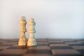 White king and queen copper chess board on a white background Royalty Free Stock Photo