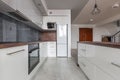 White kitchen with granite worktop Royalty Free Stock Photo