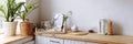 White kitchen interior with wooden countertop Royalty Free Stock Photo