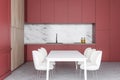 White kitchen with red counters and table Royalty Free Stock Photo