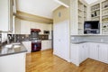 White kitchen room with burgundy stove