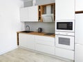 White kitchen scandinavian interior with cooker hood on wooden countertop Royalty Free Stock Photo