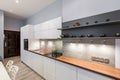 White kitchen with wooden countertop