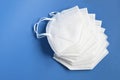 White KN95 or N95 mask for protection against coronavirus on brown background. Surgical protective mask. Royalty Free Stock Photo