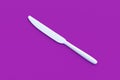 White knife on violet background