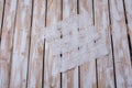 White knitted hardanger floor cloth on the worn wooden planks Royalty Free Stock Photo