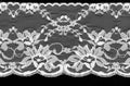 White lace on a black background. Royalty Free Stock Photo