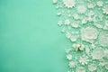 White lace border with flowers on green background with copy space. Generative AI Royalty Free Stock Photo