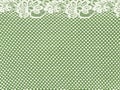 White lace border on green background