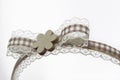 White lace bow with wooden flower. Life, creativity