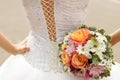 White lace corset wedding dress of the bride and the bridal bouquet Royalty Free Stock Photo