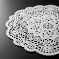 The white lace and dark background emphasizes the detailed cutwork Royalty Free Stock Photo
