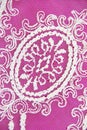 White lace fabric with floral ornament on pink background Royalty Free Stock Photo