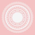 White lace napkin on a pink background. Openwork round frame. Royalty Free Stock Photo