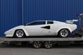 White Lamborghini Countach front with blue background