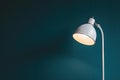 White Desk Lamp on Teal Wall Royalty Free Stock Photo