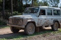 White Land Rover Defender in a wilderness