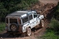 White Land Rover Defender in a wilderness