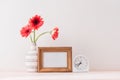 White landscape frame mock up with a vase of gerbera beside the frame, overlay your quote, promotion, headline, or design, great Royalty Free Stock Photo