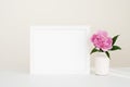 White landscape frame mockup with pink peony flower