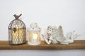 White lantern and Fairy statue Home decoration accessories on wooden shelves