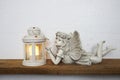 White lantern and Fairy statue Home decoration accessories on wooden shelves