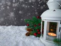 White lantern glowing on a snowy christmas night. Royalty Free Stock Photo