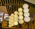 White lanterns hanging in shopping mall