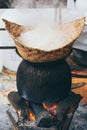 White laotian steam rice cooking on wood burning stove in Luang Prabang, Laos Royalty Free Stock Photo