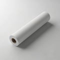White large format paper roll for printing and plotting, showcased in a minimalist studio setting isolated on white background Royalty Free Stock Photo