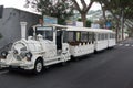 White and large public transport on a street in the city of Ischia Italy