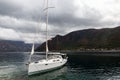 White large yacht stands at the pier in the town of Perast Royalty Free Stock Photo